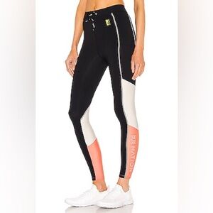 P.E Nation Forward Pass Leggings in Black with Peach and White panels